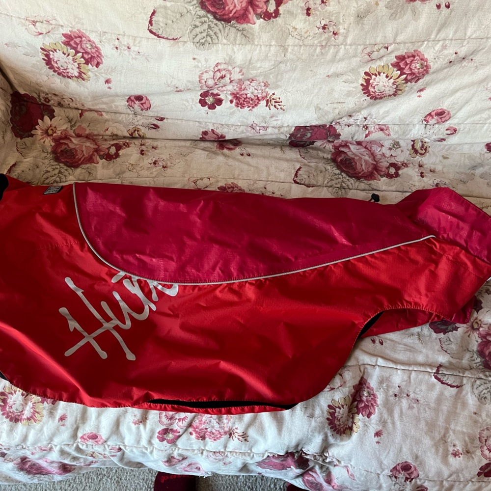 Hurtta dog rain coat.  Red.  Size 24” length across back.